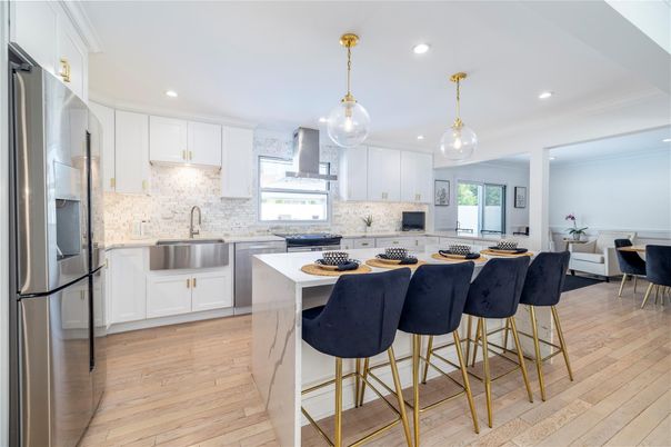 Dining room, Interior, Kitchen, Pendant Lights, Recessed Lighting, Stainless Steel Appliances, Wood Texture Flooring