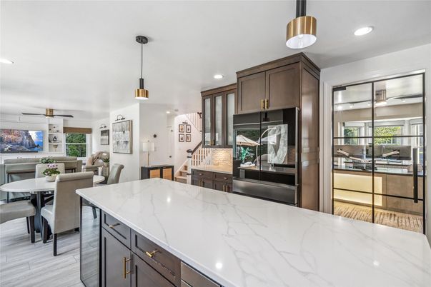 Dining room, Interior, Kitchen, Pendant Lights, Recessed Lighting, Stainless Steel Appliances, Wood Texture Flooring