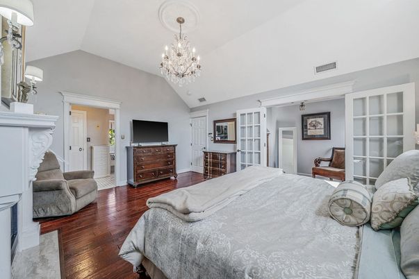 Bedroom, Chandelier, Fireplace, Interior, Wood Texture Flooring