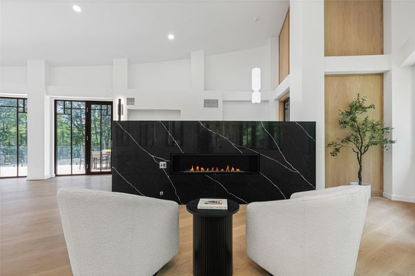 Fireplace, Interior, Living room, Marble Walls, Pendant Lights, Recessed Lighting, Wood Texture Flooring