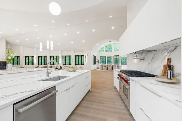 Interior, Kitchen, Marble Walls, Pendant Lights, Recessed Lighting, Stainless Steel Appliances, Wood Texture Flooring