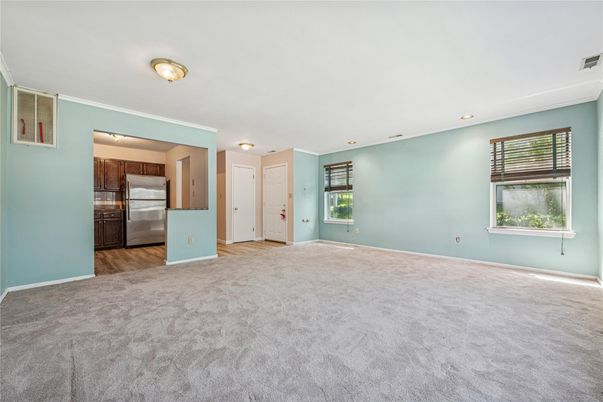 Empty room, Interior, Kitchen, Recessed Lighting, Stainless Steel Appliances, Wood Texture Flooring