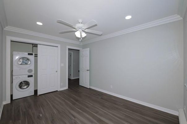 Empty room, Interior, Recessed Lighting, Utility Closets, Washer, Wood Texture Flooring