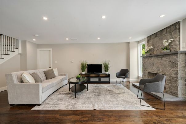 Fireplace, Interior, Living room, Recessed Lighting, Stone Walls, Wood Texture Flooring