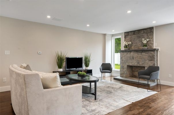 Fireplace, Interior, Living room, Recessed Lighting, Stone Walls, Wood Texture Flooring