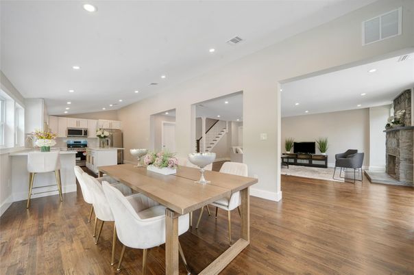 Dining room, Fireplace, Interior, Kitchen, Recessed Lighting, Stainless Steel Appliances, Wood Texture Flooring