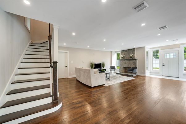 Fireplace, Interior, Living room, Recessed Lighting, Stone Walls, Wood Texture Flooring