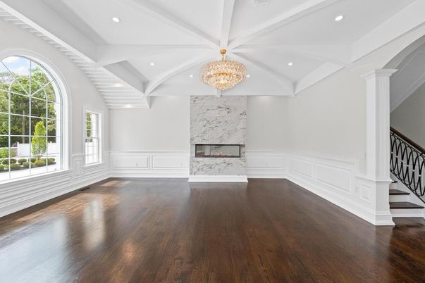 Chandelier, Empty room, Fireplace, Interior, Marble Walls, Recessed Lighting, Wood Texture Flooring