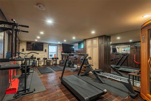 Fitness Equipment, Gym, Interior, Recessed Lighting, Stone Walls, Wood Texture Flooring