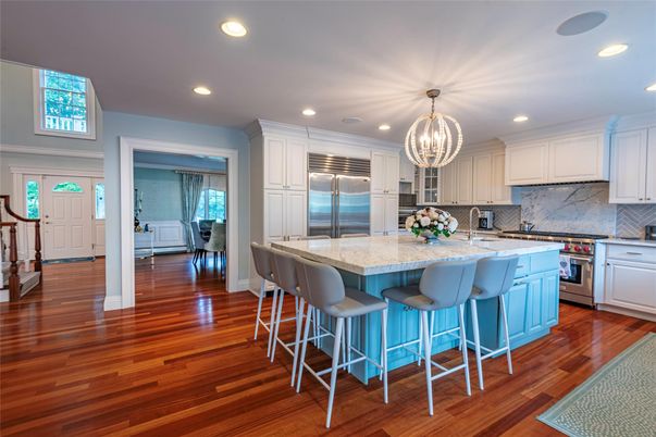 Chandelier, Interior, Kitchen, Marble Walls, Recessed Lighting, Stainless Steel Appliances, Wood Texture Flooring