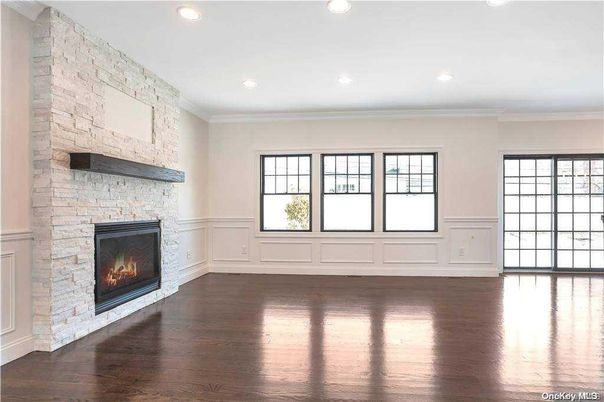 Empty room, Fireplace, Interior, Recessed Lighting, Stone Walls, Wood Texture Flooring