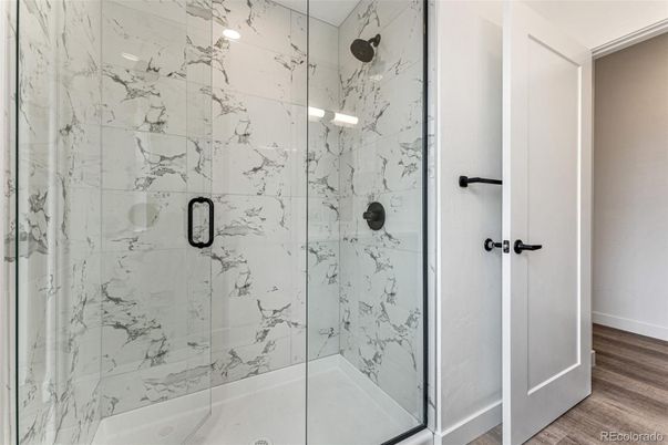 Bathroom, Glass Shower, Interior, Marble Walls, Wood Texture Flooring