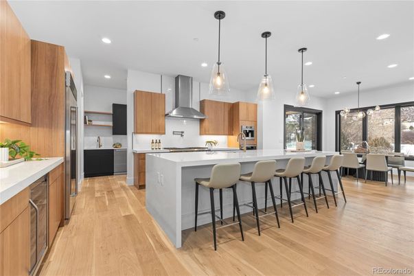 Dining room, Interior, Kitchen, Pendant Lights, Recessed Lighting, Stainless Steel Appliances, Wood Texture Flooring