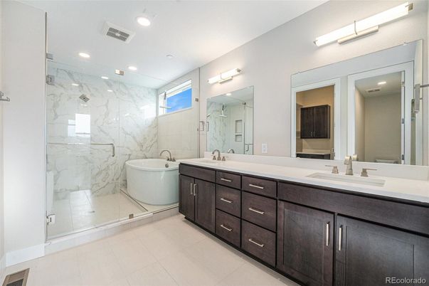 Bathroom, Dual Sink Vanities, Glass Shower, Interior, Marble Walls, Recessed Lighting