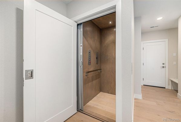 Elevator, Interior, Recessed Lighting, Wood Texture Flooring, Wooden Walls