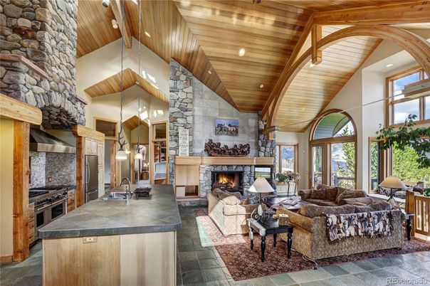 Fireplace, Interior, Kitchen, Living room, Pendant Lights, Recessed Lighting, Stainless Steel Appliances, Stone Walls, Wooden Beams, Wooden Ceilings