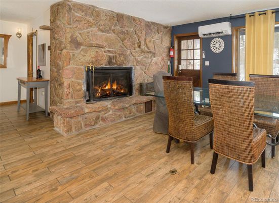 Dining room, Fireplace, Interior, Stone Walls, Wood Texture Flooring
