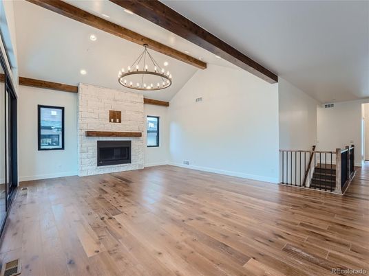 Chandelier, Empty room, Fireplace, Interior, Recessed Lighting, Wooden Beams, Wood Texture Flooring