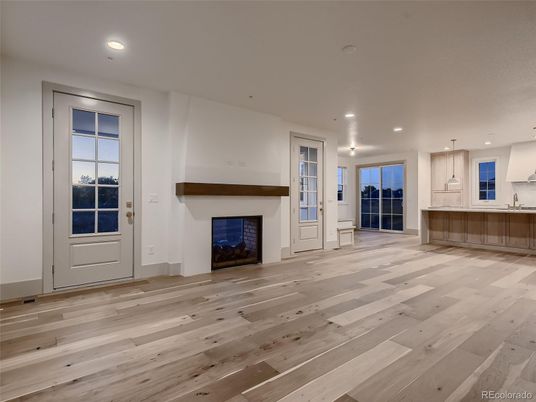 Empty room, Fireplace, Interior, Kitchen, Pendant Lights, Recessed Lighting, Wood Texture Flooring