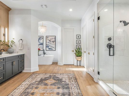Bathroom, Chandelier, Free Standing Baths, Glass Shower, Interior, Recessed Lighting, Wood Texture Flooring