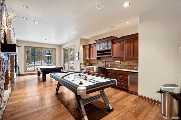 Billiard Table, Game Room, Interior, Kitchen, Pendant Lights, Recessed Lighting, Stainless Steel Appliances, Wood Texture Flooring