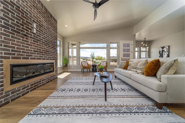Fireplace, Interior, Living room, Pendant Lights, Recessed Lighting, Stone Walls, Wood Texture Flooring