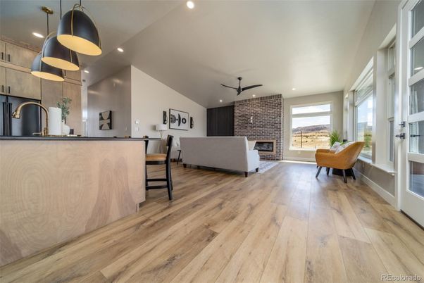 Dining room, Fireplace, Interior, Kitchen, Living room, Pendant Lights, Recessed Lighting, Stone Walls, Wood Texture Flooring