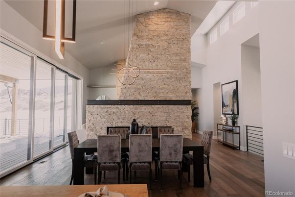 Dining room, Fireplace, Interior, Pendant Lights, Stone Walls, Wood Texture Flooring