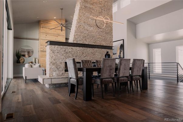 Dining room, Fireplace, Interior, Pendant Lights, Recessed Lighting, Stone Walls, Wood Texture Flooring