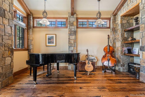 Fireplace, Interior, Pendant Lights, Piano, Stone Walls, Wood Texture Flooring