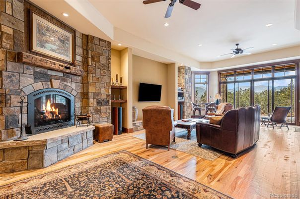 Fireplace, Interior, Living room, Recessed Lighting, Stone Walls, Wood Texture Flooring