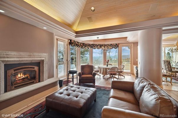Chandelier, Dining room, Fireplace, Interior, Living room, Recessed Lighting, Wooden Ceilings, Wood Texture Flooring