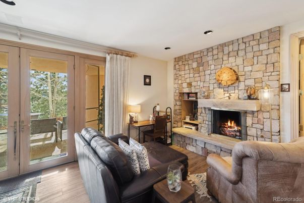 Fireplace, Interior, Living room, Recessed Lighting, Stone Walls, Wood Texture Flooring