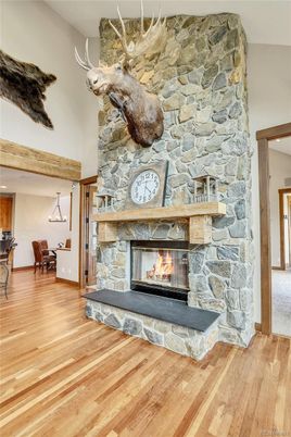 Dining room, Fireplace, Interior, Pendant Lights, Stone Walls, Wood Texture Flooring