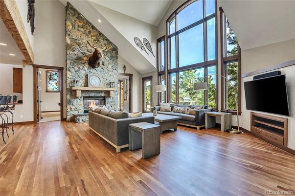 Fireplace, Interior, Living room, Recessed Lighting, Stone Walls, Wood Texture Flooring