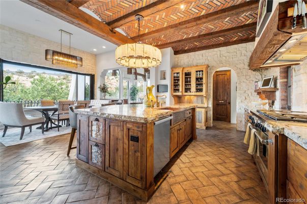 Chandelier, Dining room, Interior, Kitchen, Pendant Lights, Recessed Lighting, Stainless Steel Appliances, Stone Walls, Wooden Beams, Wooden Ceilings