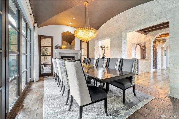 Chandelier, Dining room, Fireplace, Interior, Recessed Lighting, Stone Walls, Wood Texture Flooring