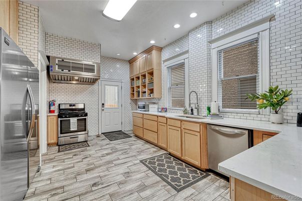 Interior, Kitchen, Recessed Lighting, Stainless Steel Appliances, Stone Walls, Wood Texture Flooring