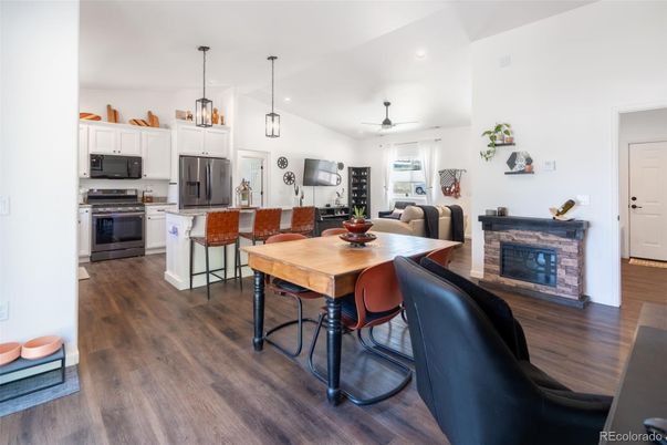 Dining room, Fireplace, Interior, Kitchen, Pendant Lights, Recessed Lighting, Stainless Steel Appliances, Wood Texture Flooring