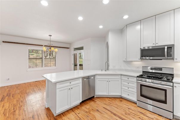 Chandelier, Interior, Kitchen, Recessed Lighting, Stainless Steel Appliances, Wood Texture Flooring