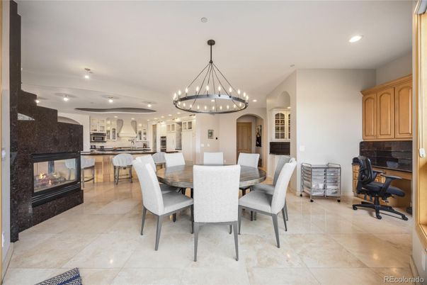 Chandelier, Dining room, Fireplace, Interior, Kitchen, Pendant Lights, Recessed Lighting, Stainless Steel Appliances