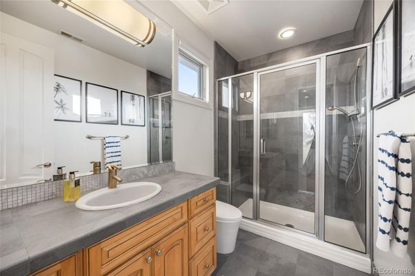 Bathroom, Dual Sink Vanities, Glass Shower, Interior, Recessed Lighting, Tile Countertops