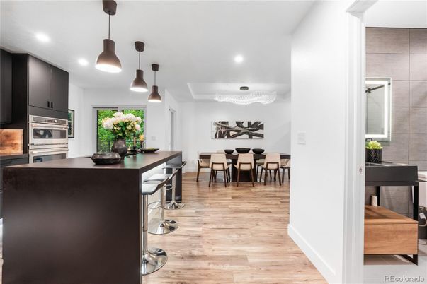 Dining room, Interior, Kitchen, Pendant Lights, Recessed Lighting, Stainless Steel Appliances, Wood Texture Flooring