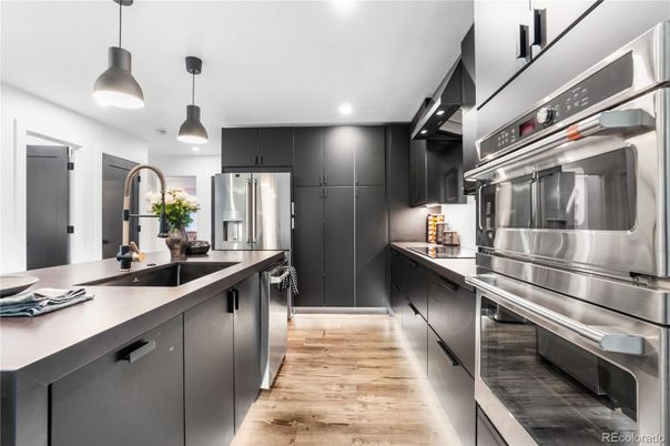 Interior, Kitchen, Pendant Lights, Recessed Lighting, Stainless Steel Appliances, Wood Texture Flooring