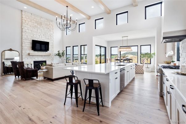 Chandelier, Dining room, Fireplace, Interior, Kitchen, Living room, Pendant Lights, Recessed Lighting, Stone Walls, Wooden Beams, Wood Texture Flooring