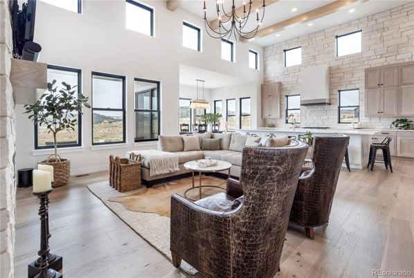 Chandelier, Dining room, Fireplace, Interior, Kitchen, Living room, Pendant Lights, Recessed Lighting, Stone Walls, Wood Texture Flooring