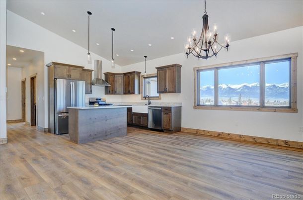 Chandelier, Interior, Kitchen, Pendant Lights, Recessed Lighting, Stainless Steel Appliances, Wood Texture Flooring