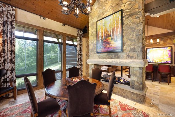 Chandelier, Dining room, Fireplace, Interior, Pendant Lights, Stone Walls, Wooden Beams, Wooden Ceilings