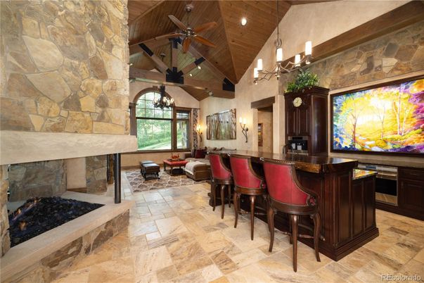 Chandelier, Fireplace, Interior, Living room, Recessed Lighting, Stone Walls, Wooden Beams, Wooden Ceilings