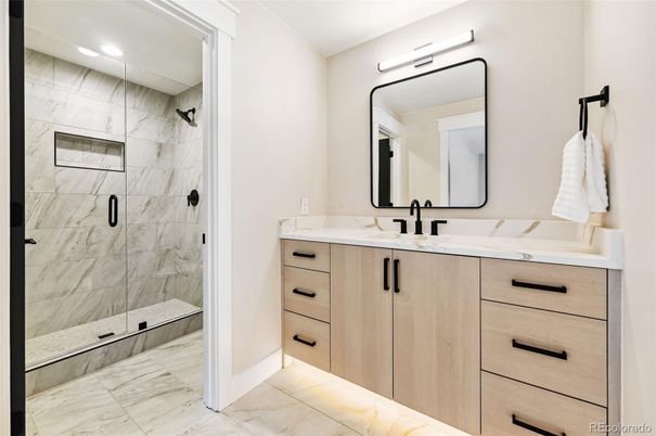 Bathroom, Dual Sink Vanities, Glass Shower, Interior, Marble, Marble Walls, Recessed Lighting